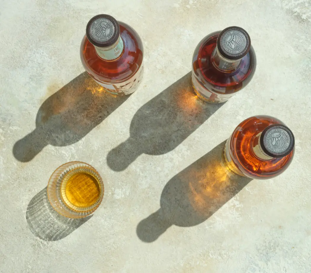 top down on three bottles with glass